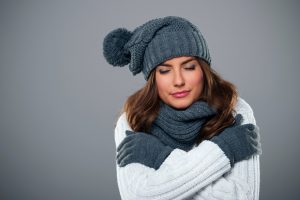 Young woman shivering during the winter season