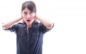 woman covering her ears, imposed on a white background