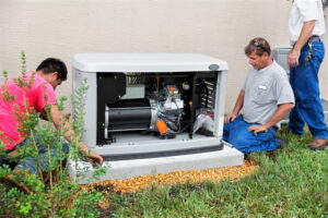 Three technicians servicing a generator.