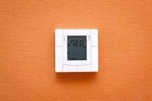 thermostat-mounted-on-wall