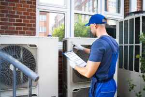 AC-technician-working-on-outdoor-unit